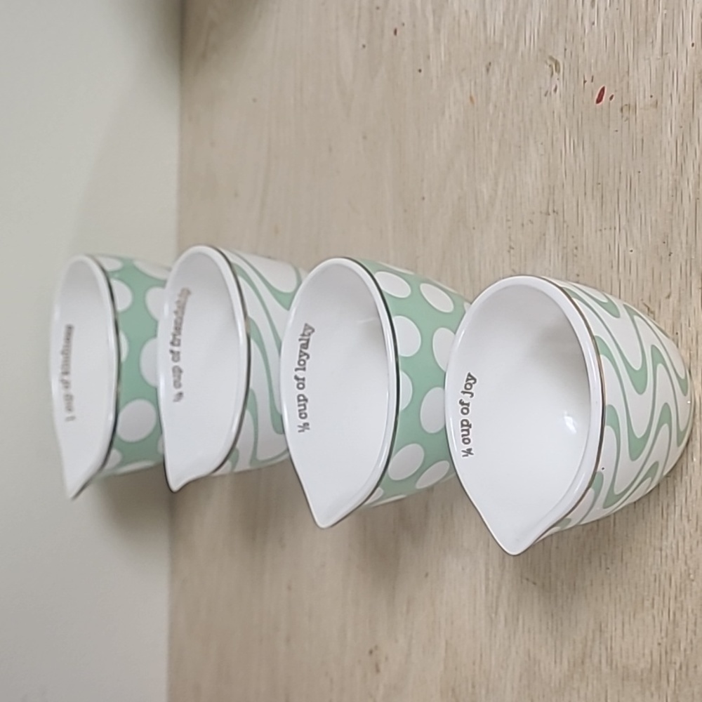 Kindness measuring cups made of glass. With gold trim around top. See pictures.